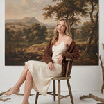 graced Chloe chunky knit cardigan in mocha worn by a blonde model over a cream slip dress in a rustic setting