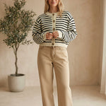 Navy chunky knit striped cardigan by Miou Muse, featuring a cozy, thick sweater with horizontal blue and white stripes.