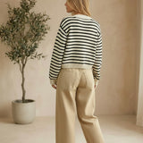 Navy chunky knit striped cardigan by Miou Muse, featuring a cozy, textured sweater with bold horizontal stripes.
