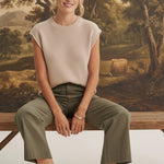Model wearing graced The Darcy wide-leg pocket detail pants in dark olive with a beige knit top and ankle boots
