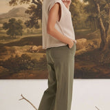graced The Darcy wide-leg pants in dark olive with pocket detail, worn by a blonde model in a beige sleeveless top.