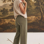 graced The Darcy wide-leg pants in dark olive with pocket detail worn by a model with a beige top and ankle boots