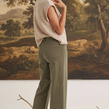 graced The Darcy wide-leg pants in dark olive with pocket detail worn by a model with a beige top and ankle boots