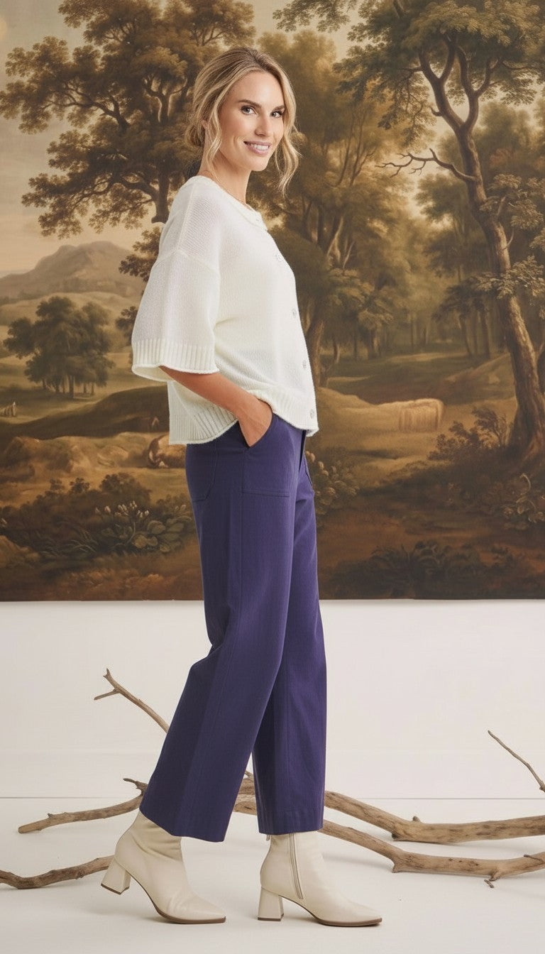 graced Darcy wide-leg navy pants with pocket detail worn by a model with a white sweater and cream ankle boots