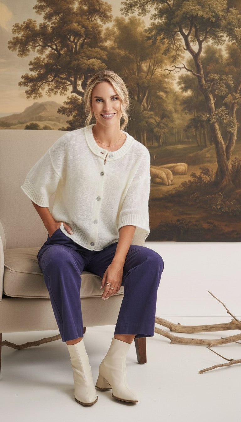 graced Darcy navy wide-leg pants with pocket detail worn by a model in a white cardigan and cream ankle boots