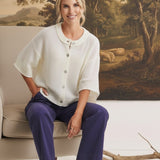 graced Darcy navy wide-leg pants with pocket detail worn by a model in a white cardigan and cream ankle boots