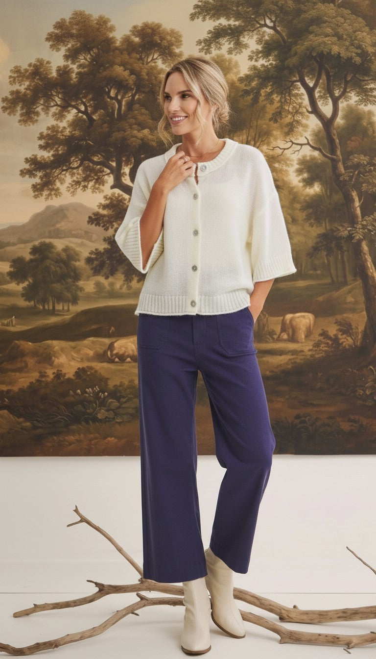 Model wearing graced The Darcy navy wide-leg pants with pocket detail and a cream button-down knit cardigan