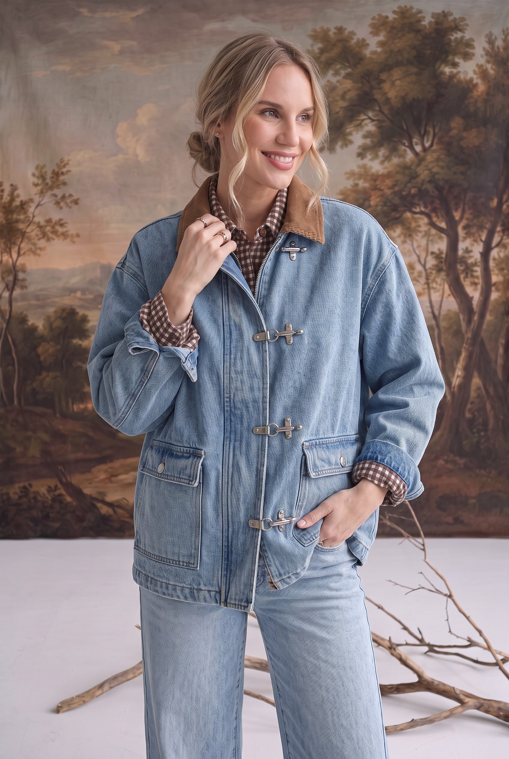 graced Julie denim jacket with brown corduroy collar and metal latch hook closures worn by a smiling model