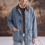 graced Julie denim jacket with brown corduroy collar and latch hook closures worn by a model in a studio setting