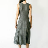 Graceful Skyler Dress by graced featuring a stylish silhouette and elegant fabric, displayed on a hanger against a neutral background.
