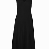 Gray graced Skyler Dress shown on a hanger with a flowing silhouette and elegant design.