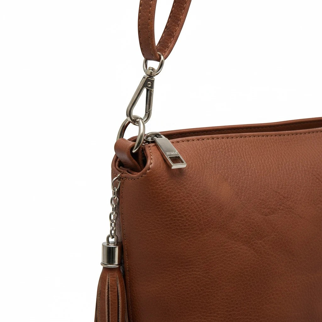 Brown Dylan Tassel Crossbody bag by Jen & Co, showing a stylish accessory with tassel detail and adjustable strap.