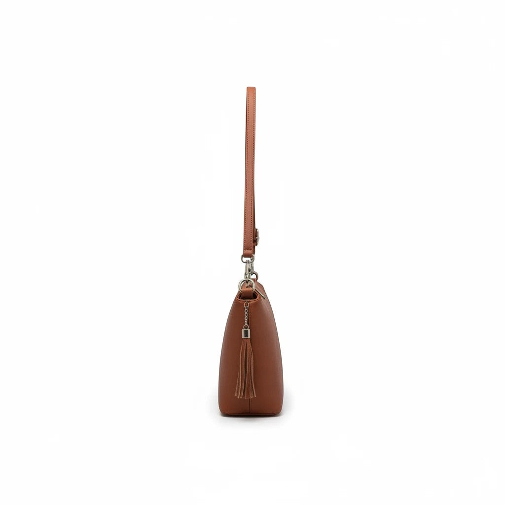 Brown Dylan Tassel Crossbody bag by Jen & Co, showcasing a stylish accessory with tassel detailing and adjustable strap.