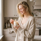 Graced Elevate Natural Soy Wax Candle in a clear glass jar, featuring a minimalist label and a lit wick for cozy ambiance.