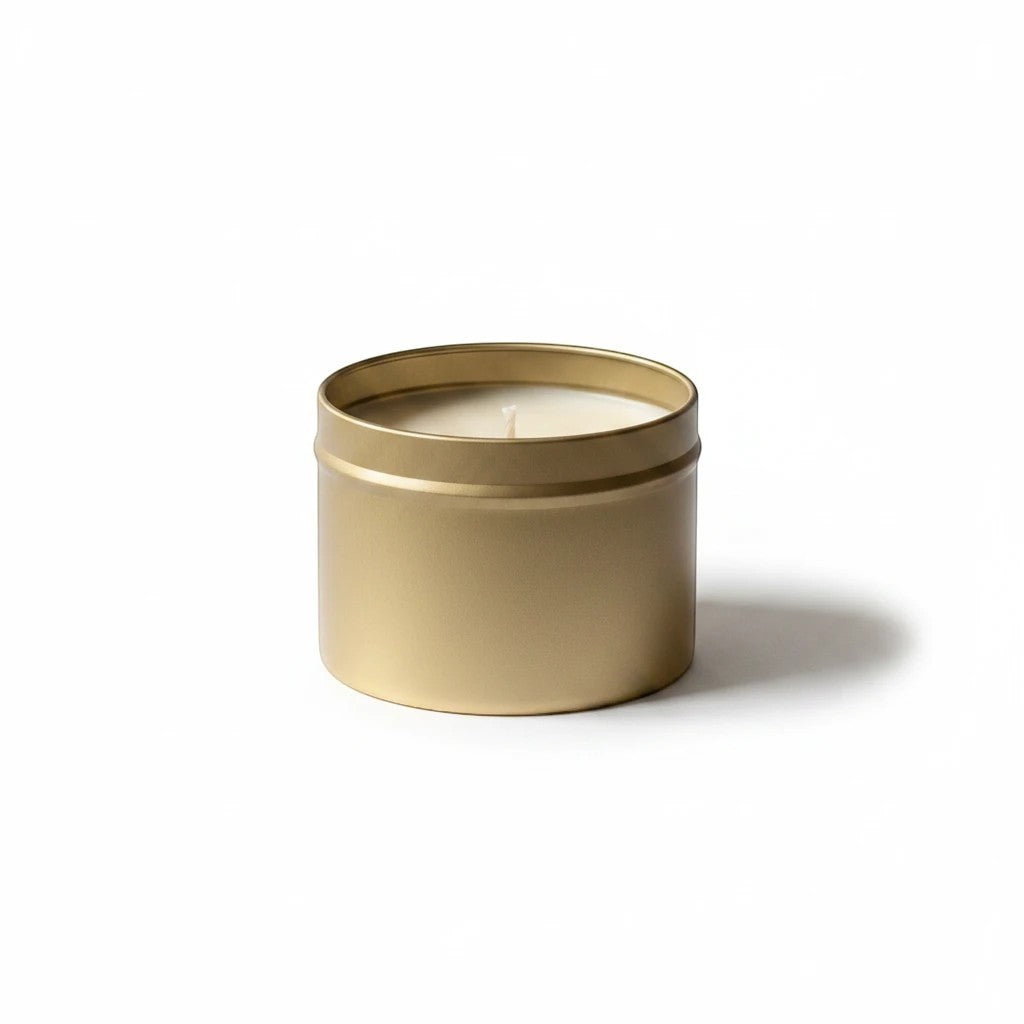 Graced Elevate natural soy wax candle in a gold tin with a lit wick, designed for home fragrance and ambiance.