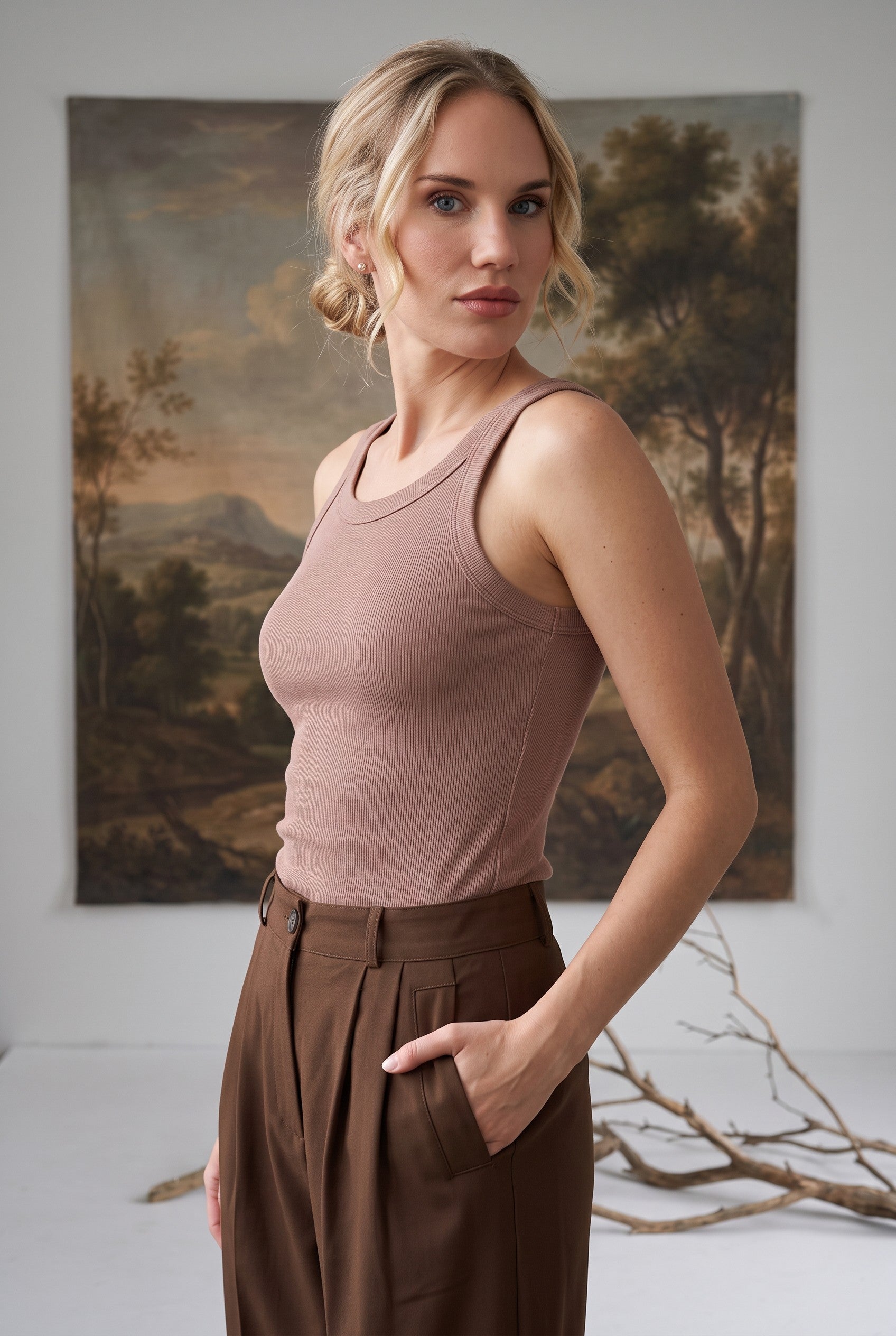 graced Ellie Bra Free Tank in taupe, a soft ribbed sleeveless top worn by a model with brown trousers