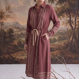 graced midi dress in dusty rose with contrast embroidery, button front, and drawstring waist on a model