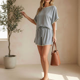 Allie Rose embroidered linen dolman top with intricate embroidery, relaxed fit, and lightweight breathable fabric.