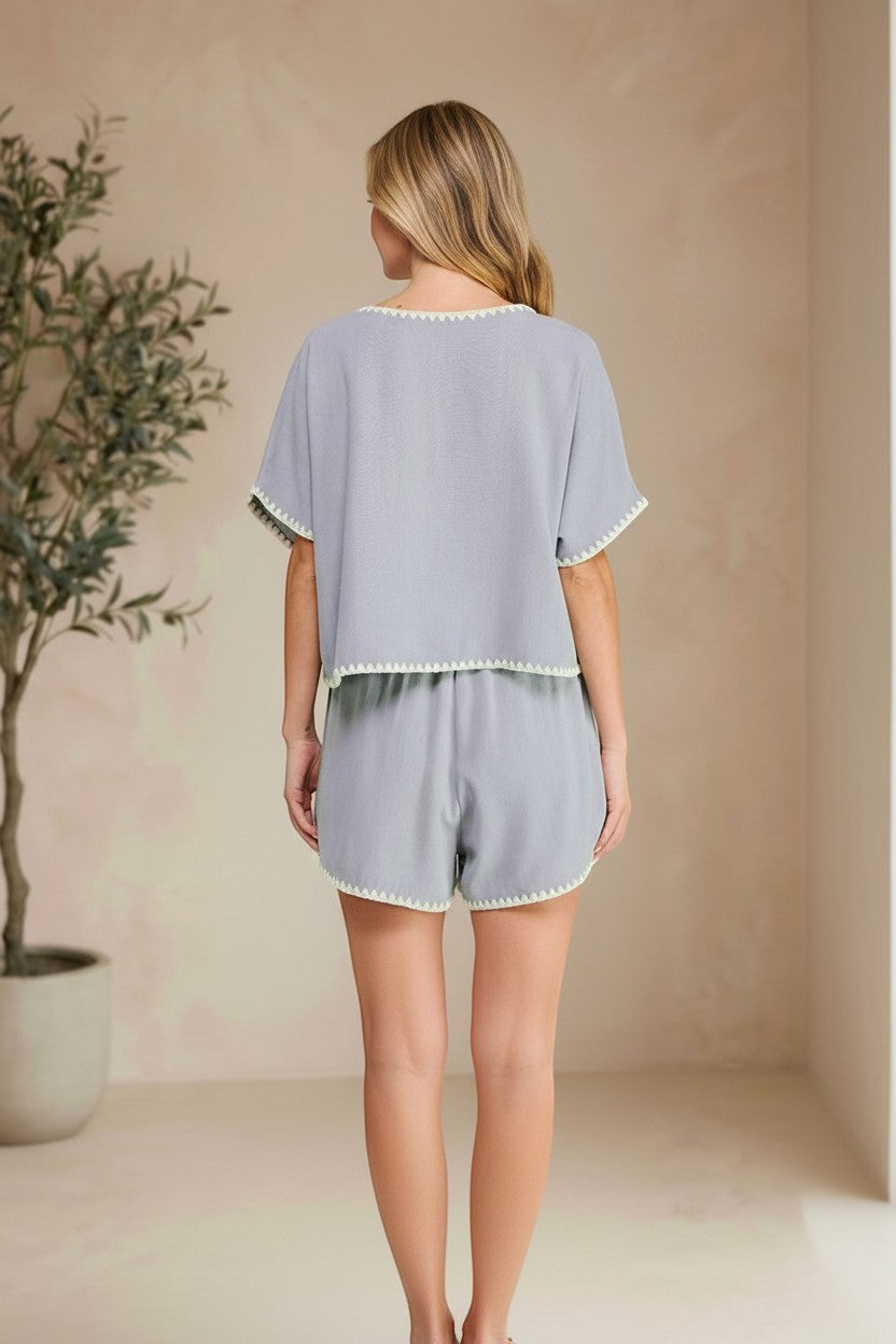 Allie Rose embroidered linen tie shorts with intricate embroidery, lightweight breathable fabric, and a relaxed fit.