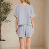 Allie Rose embroidered linen tie shorts with intricate embroidery, lightweight breathable fabric, and a relaxed fit.