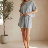Allie Rose embroidered linen tie shorts, stylish lightweight bottoms with intricate embroidery and adjustable waist tie.
