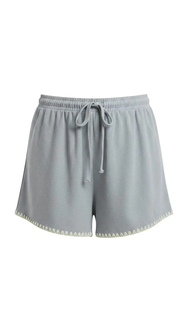 Allie Rose embroidered linen tie shorts featuring elegant embroidery, lightweight fabric, and a stylish relaxed fit for summer wear.