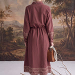graced embroidered button front midi dress in maroon with long sleeves, drawstring waist, and contrast detailing