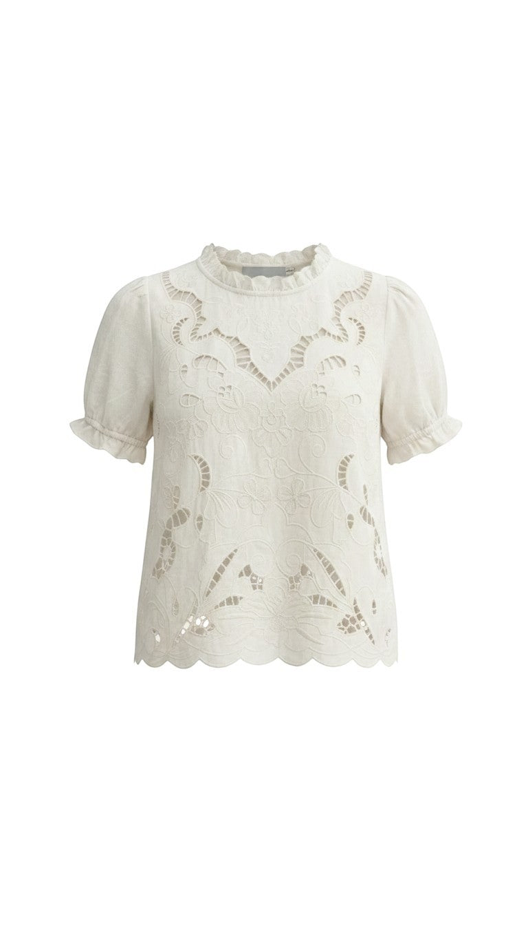 Off-white embroidered short sleeve blouse by Camellia featuring delicate floral embroidery and a relaxed fit.