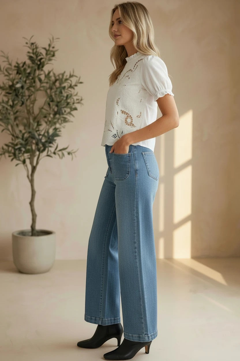 Off-white embroidered short sleeve blouse by Camellia, featuring intricate floral embroidery and a relaxed fit for casual elegance.