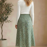 graced floral print midi skirt in green polyester with a flowing silhouette worn by a model from behind