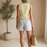 Wishlist Julia Floral Shorts in white and grey cotton with a vibrant floral pattern, perfect for casual summer wear.