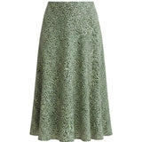 graced midi skirt in green with a delicate white floral print, featuring a flowing silhouette and polyester fabric.