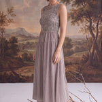 graced Harper midi dress in brown gingham with a smocked bodice, worn by a model with beige ankle boots