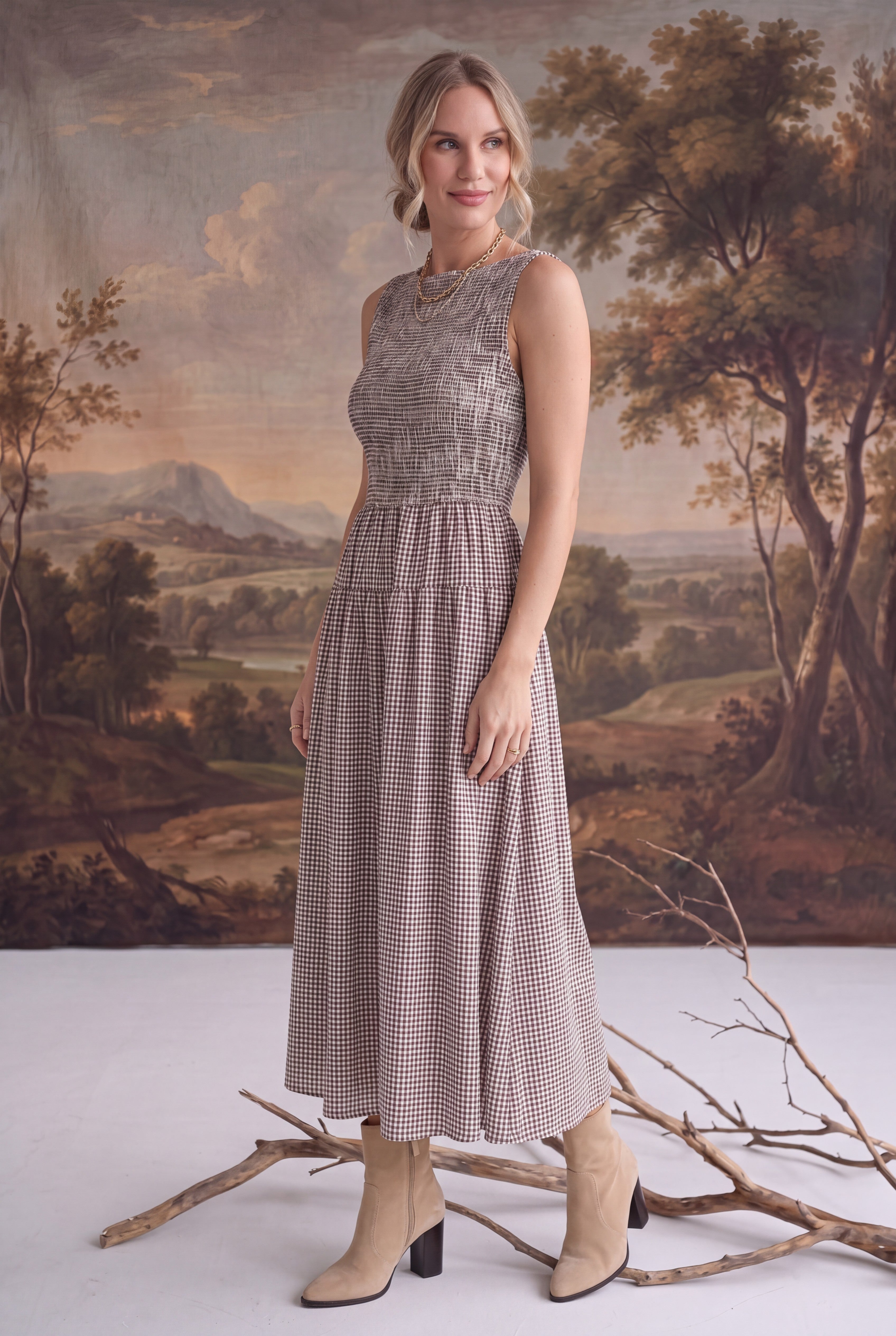 graced Harper midi dress in brown gingham with a smocked bodice, worn by a model with beige ankle boots