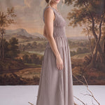 graced The Harper brown gingham midi dress with a smocked bodice worn by a model in a studio setting