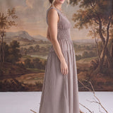 graced The Harper brown gingham midi dress with a smocked bodice worn by a model in a studio setting