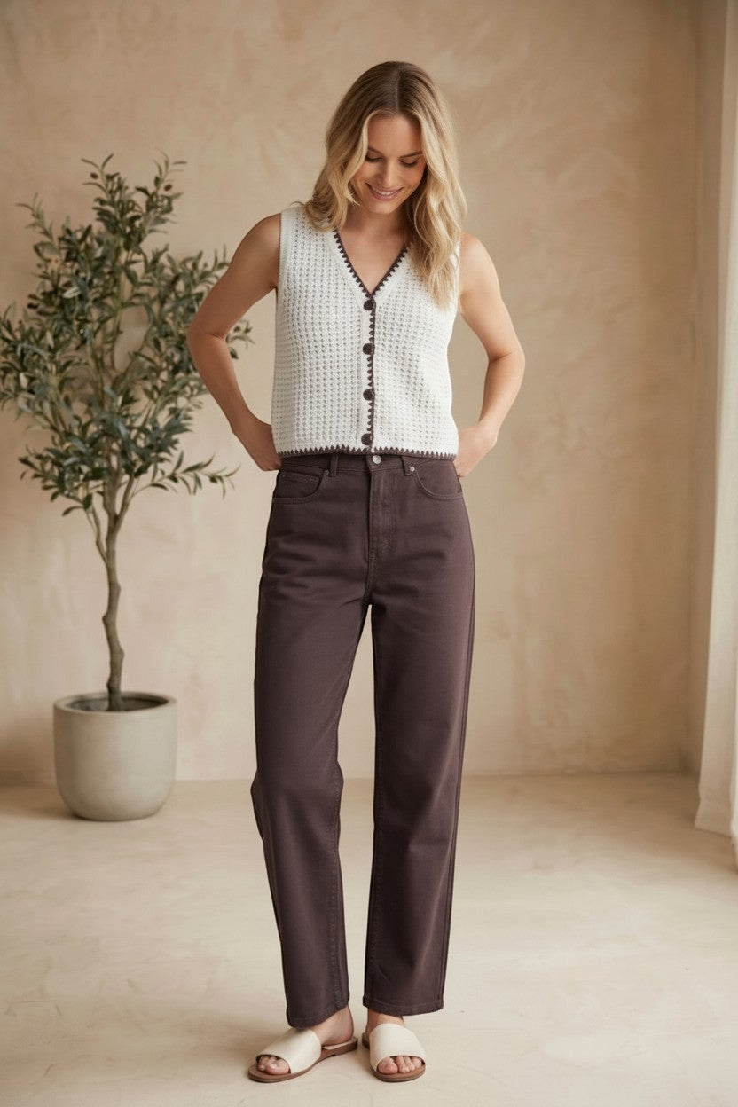 Dark brown high-rise straight jeans by Miou Muse displayed on a hanger, showcasing the sleek fit and classic denim style.