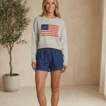 graced blue denim high-waisted shorts with elastic waist and tie detail, 3" inseam, 90% cotton