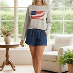 graced High Waisted Tie Shorts in dark wash denim with elastic waist and adjustable tie. Model is 5'4" wearing size S.