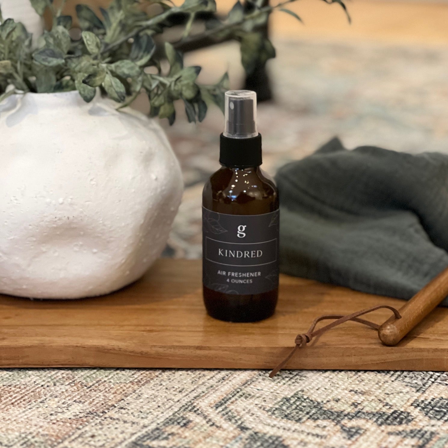 Graced Kindred air freshener for home, showcasing a sleek container with a modern design and fresh scent.
