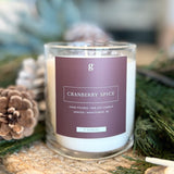 Graced cranberry spice scented candle in a glass jar, perfect for home fragrance and cozy decor.