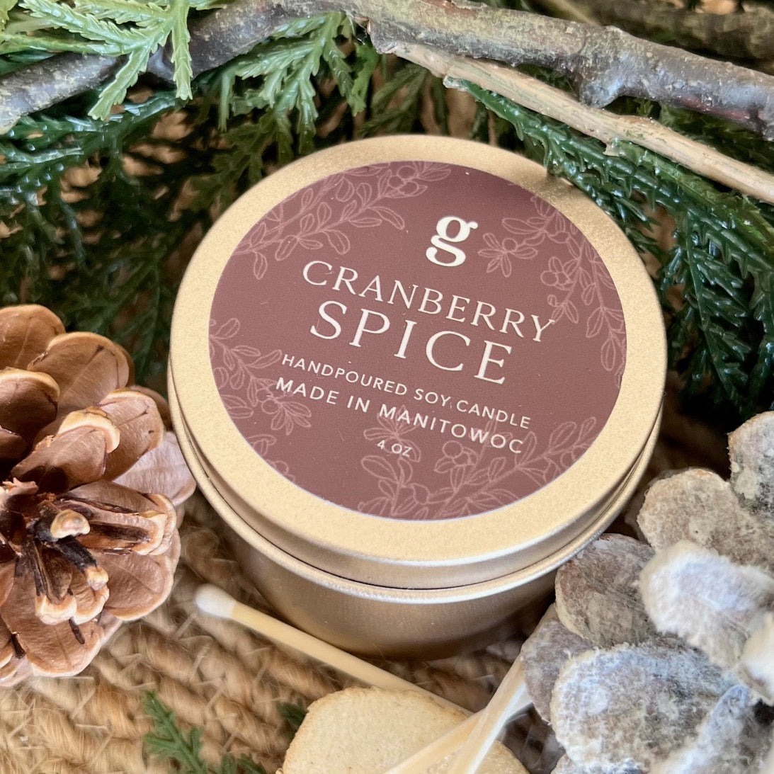 Graced Cranberry Spice scented candle in a glass jar, showcasing the warm, festive fragrance and cozy home decor appeal.