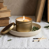 Graced Library scented soy wax candle in a small glass jar, featuring a warm, inviting design for home fragrance.
