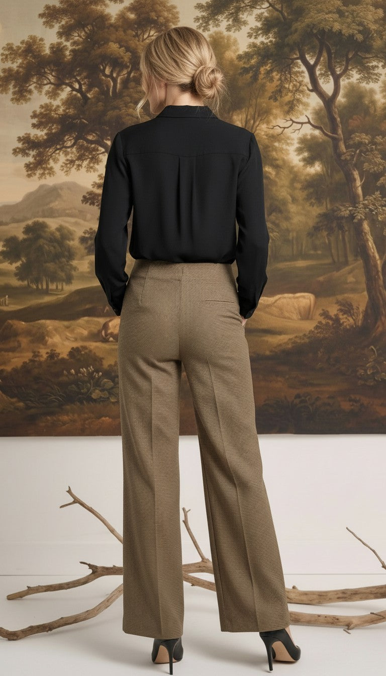 graced houndstooth knit straight pants in brown worn with a black blouse, back view