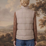 graced Karla Gingham Vest in brown and white worn over a brown lace long-sleeve top and blue jeans, back view