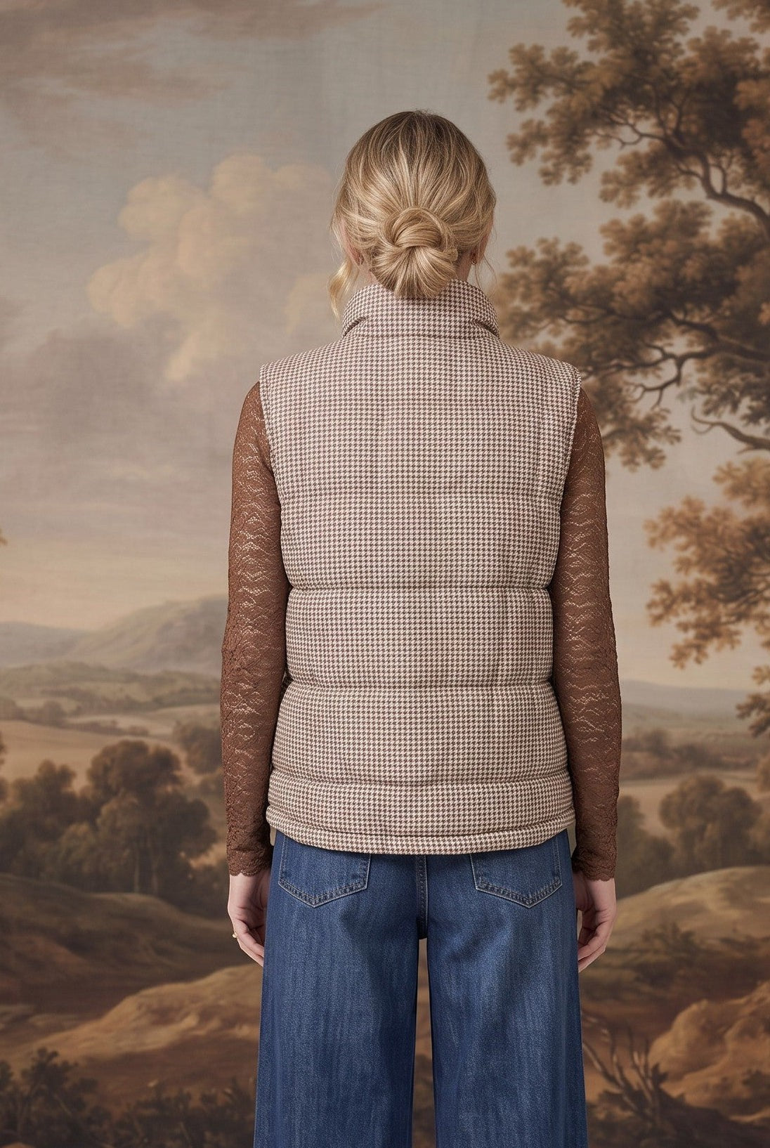 graced Karla Gingham Vest in brown and white worn over a brown lace long-sleeve top and blue jeans, back view