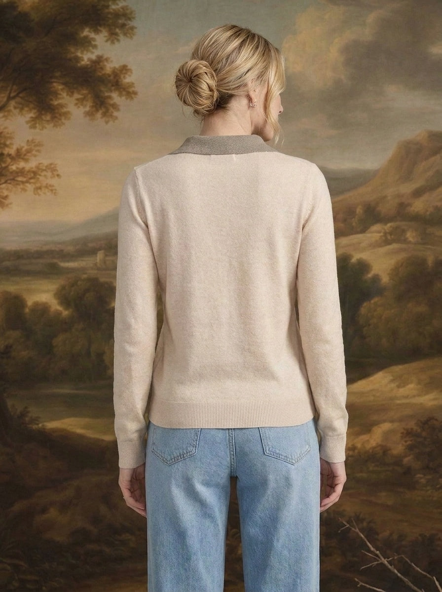 Back view of a woman wearing the graced Kate Collared Sweater in ivory and brown with a soft knit and ribbed hem.