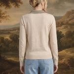Back view of a woman wearing the graced Kate Collared Sweater in ivory and brown with a soft knit and ribbed hem.