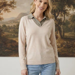 graced The Kate Collared Sweater in ivory and brown with a soft knit, v-neck collar, and relaxed fit on a model.