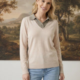 graced The Kate Collared Sweater in ivory and brown with a soft knit, v-neck collar, and relaxed fit on a model.